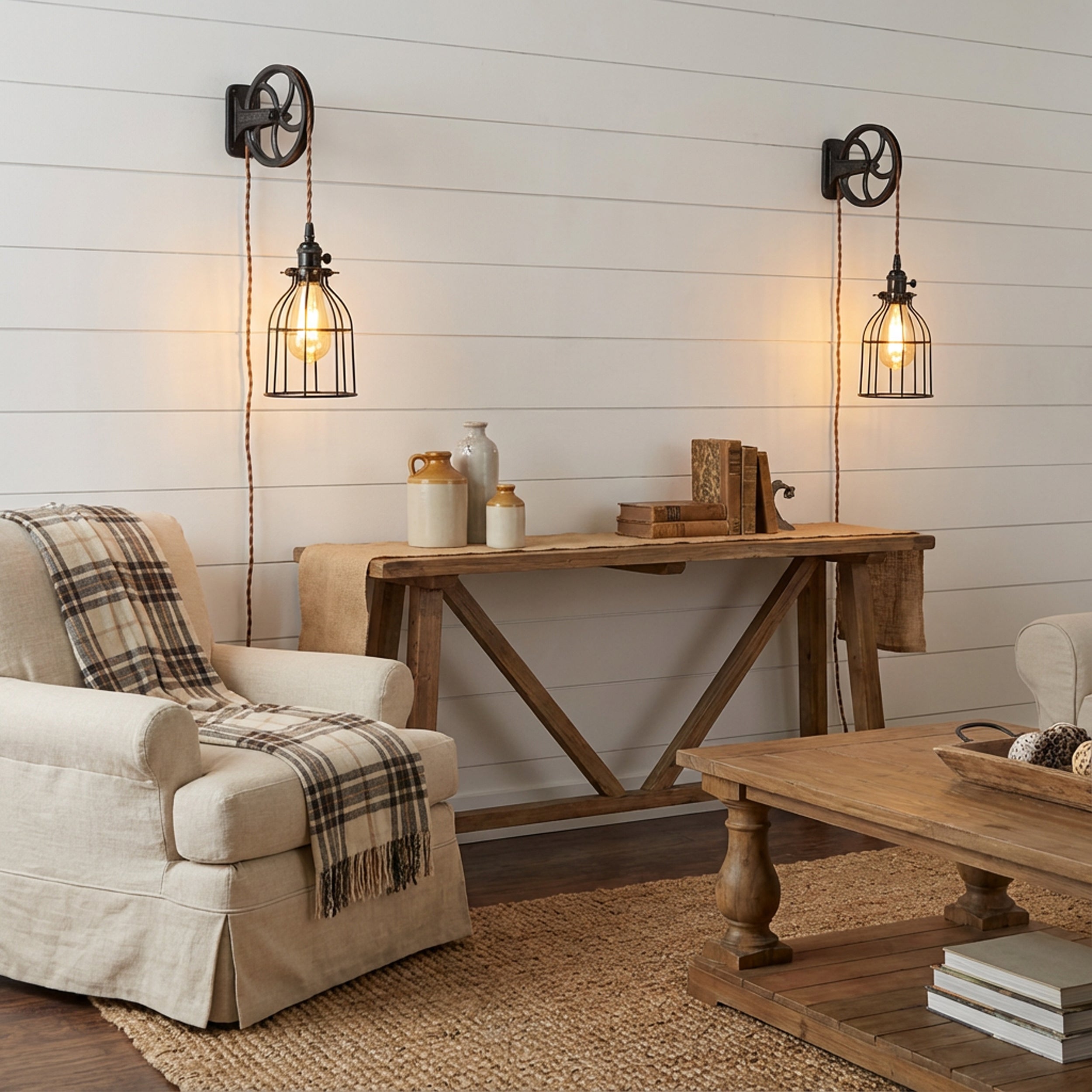 Cozy living room with rustic furniture and wall lights.