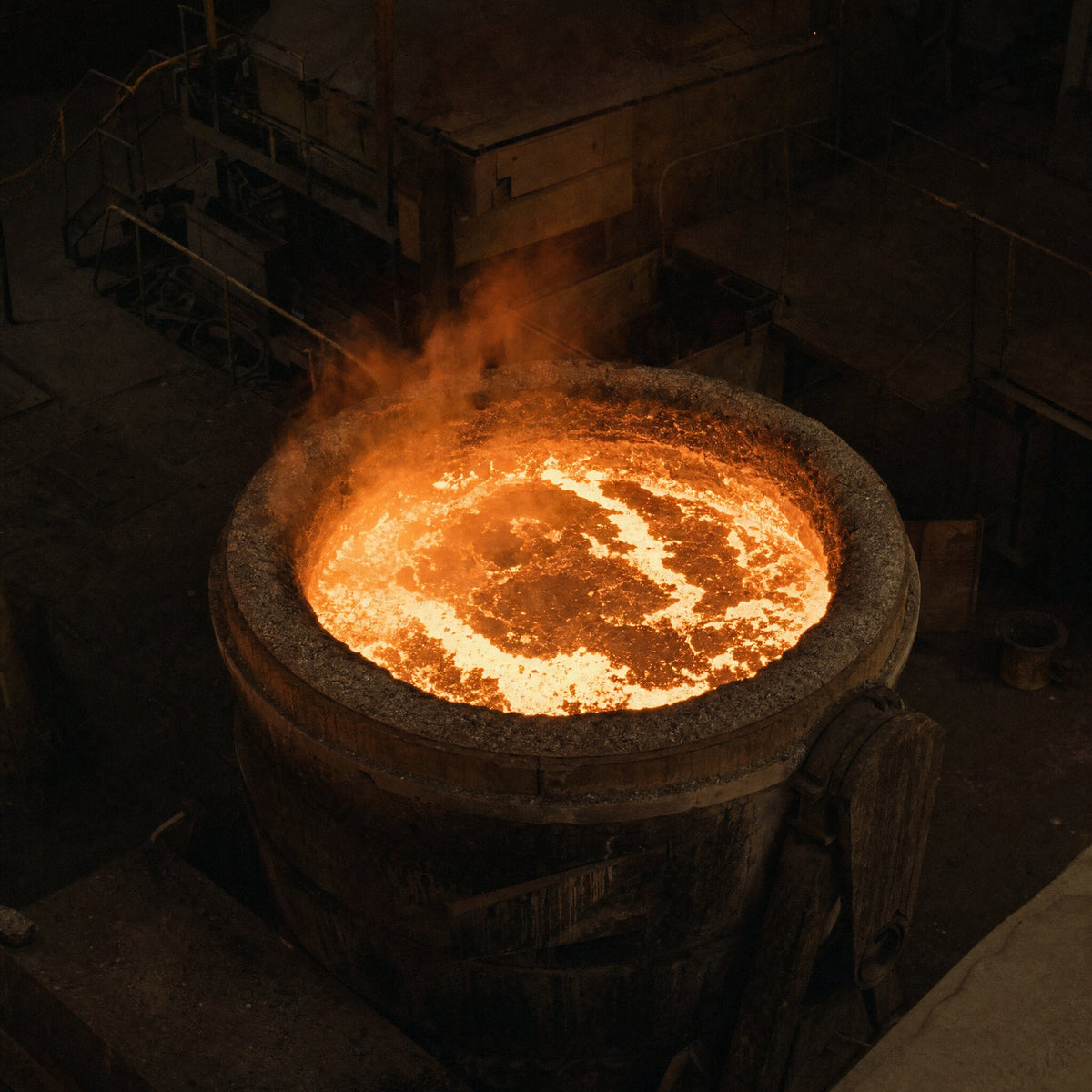 Molten iron glowing orange white in an open furnace crucible